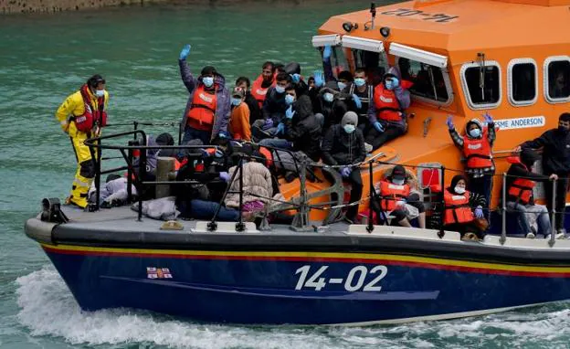 A boat arrives at the port of Dover with immigrants rescued in the English Channel. 